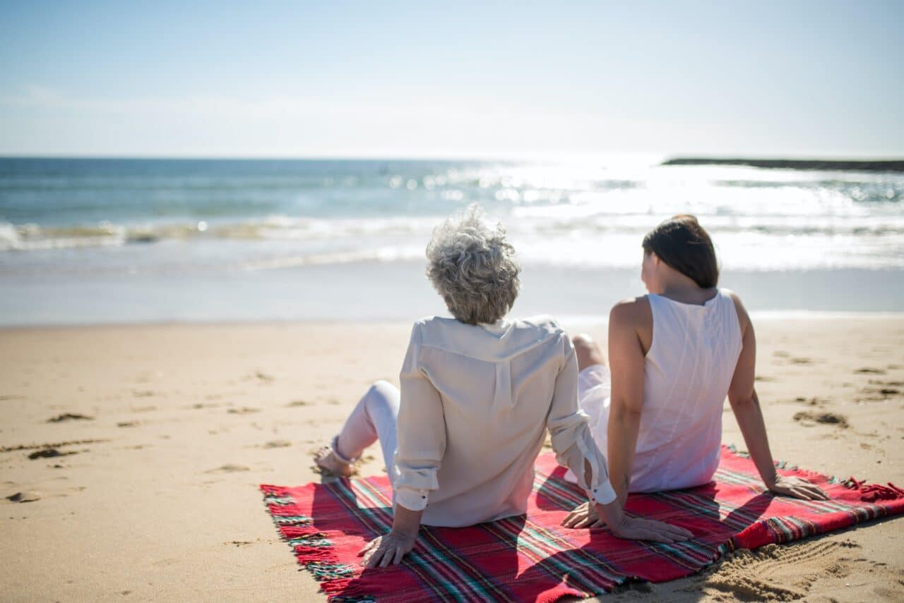 Mother and daughter enjoying a beach day.